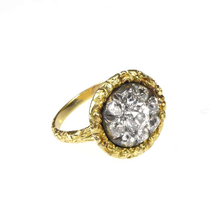 Antique cushion cut diamond circular flowerhead cluster, later mounted as a ring